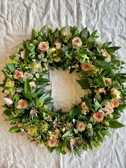 Begravningskrans i aprikost, gult & lila
